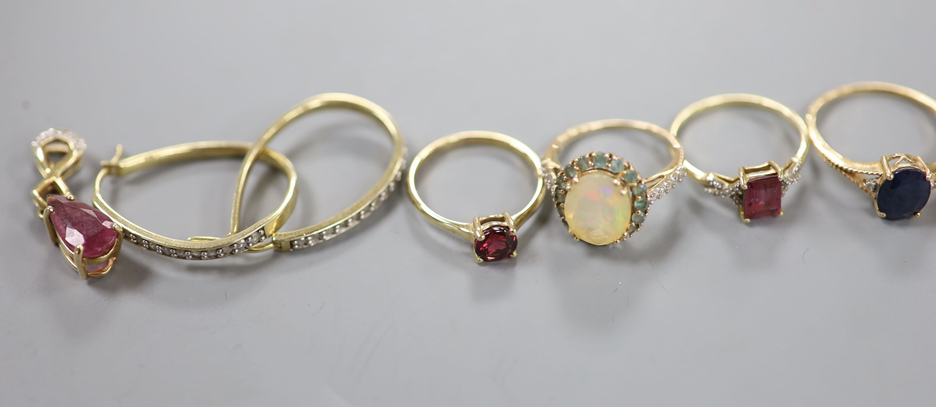 Six assorted modern 9ct gold and gem set dress rings, a pair of 9ct and gem set earrings and two 9ct gold and gem set pendants, gross weight 22.2 grams, a yellow metal and olivine? ring, gross 3.7 grams and a pair of 925